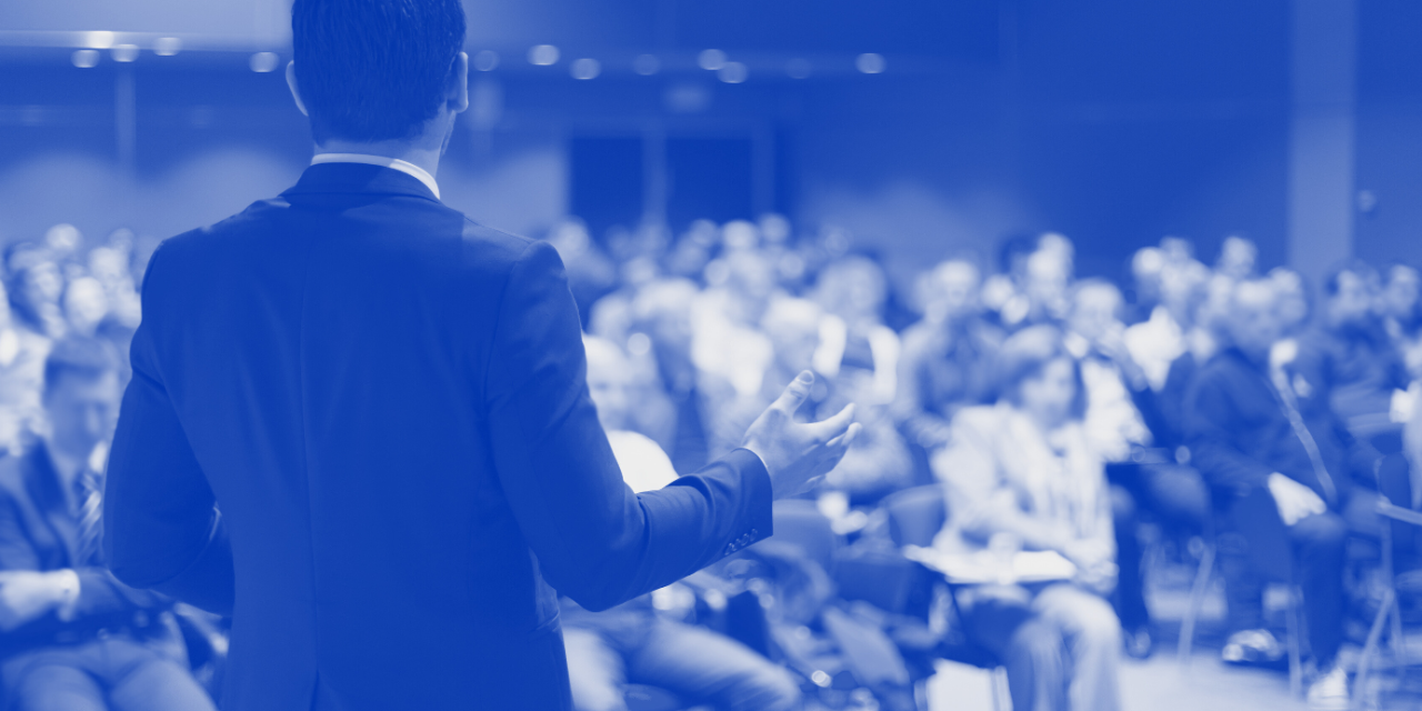 Photograph of crowd with blue overlay