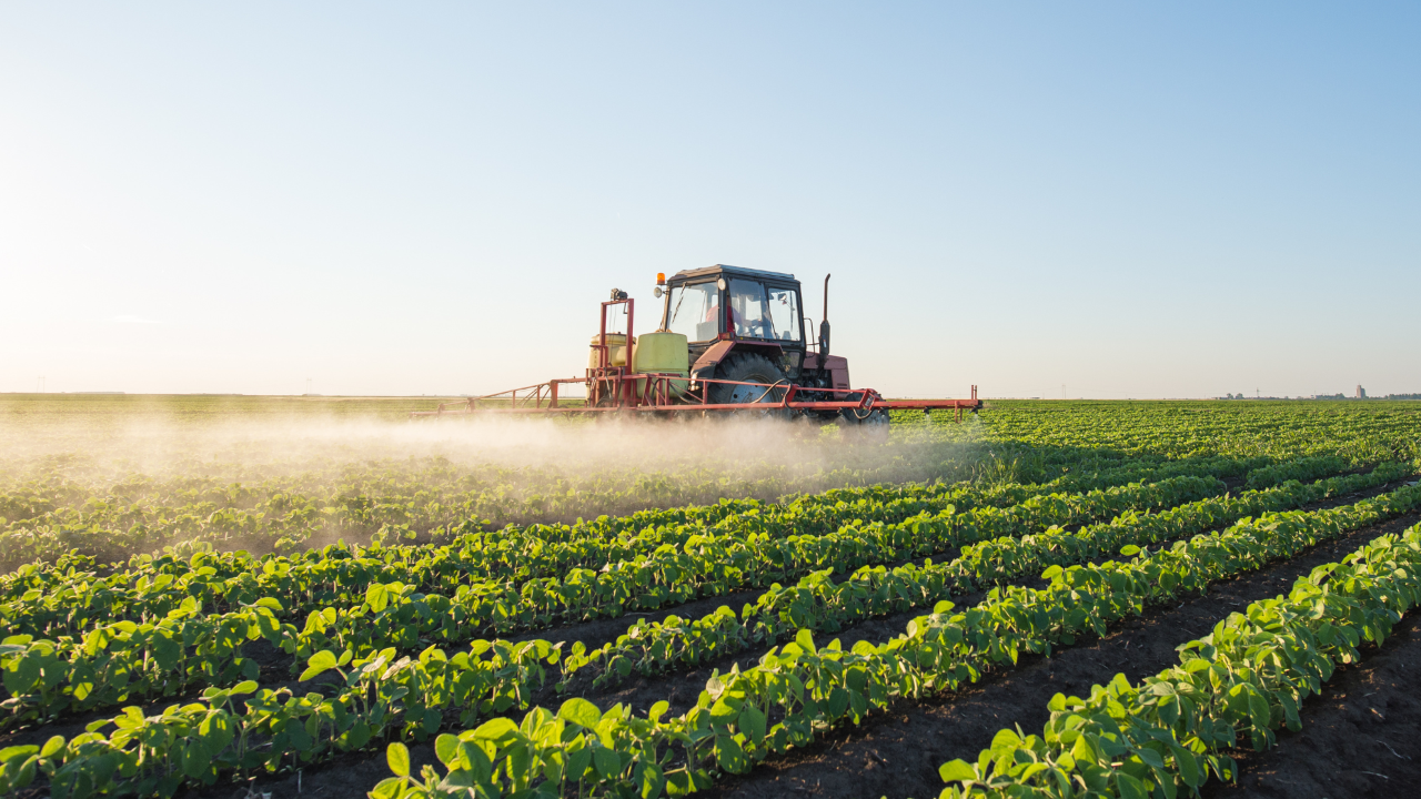 Tractor spraying field