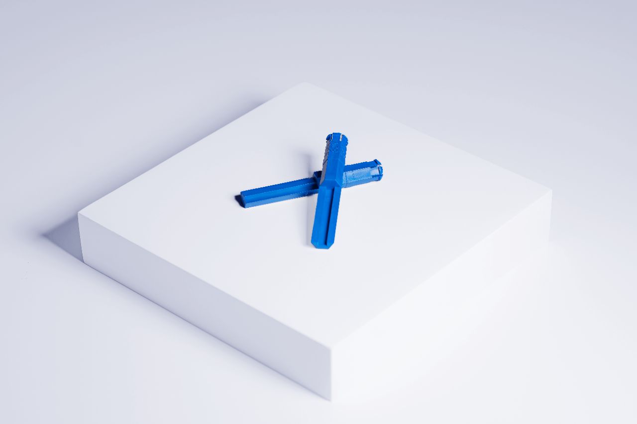 AP DIN Blue Keys laid on top of each other on a white boxon white background